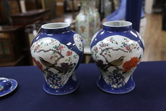 A pair of Chinese famille rose powder blue ground jars and covers, Kangxi marks, early 20th century, height 31.5cm